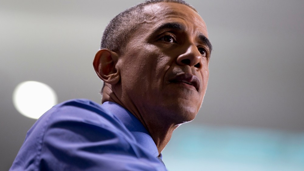 President Barack Obama pauses as he speaks at the UAW-GM Center for Human Resources in Detroit, Jan. 20, 2016. (Photo by Carolyn Kaster/AP)