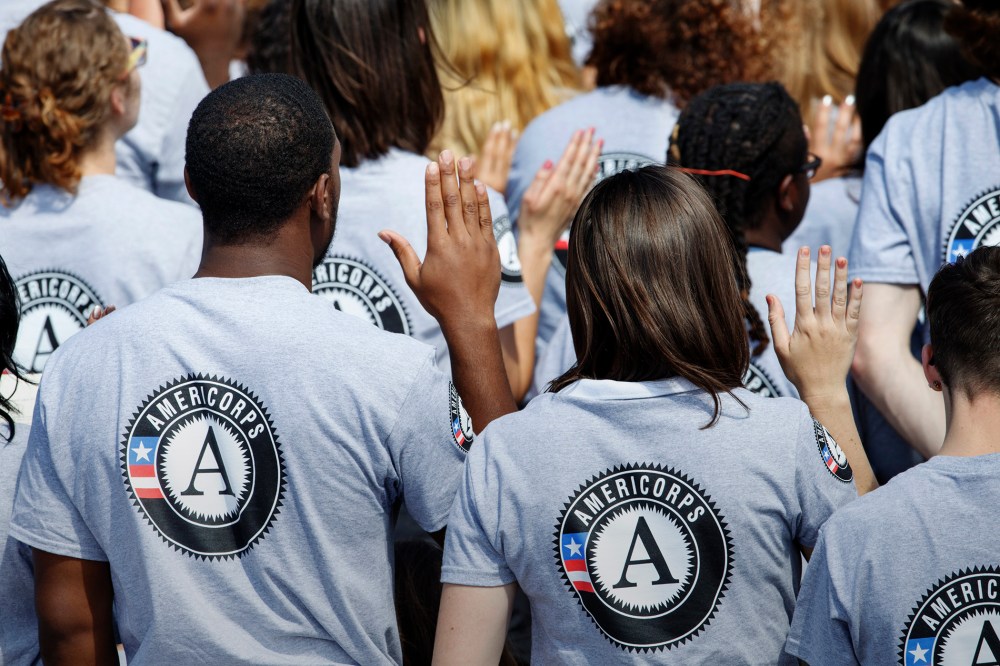 Hundreds of new AmeriCorps volunteers are sworn in for duty at a ceremony, Sept. 12, 2014, on the South Lawn of the White House in Washington. (Photo by J. Scott Applewhite/AP)