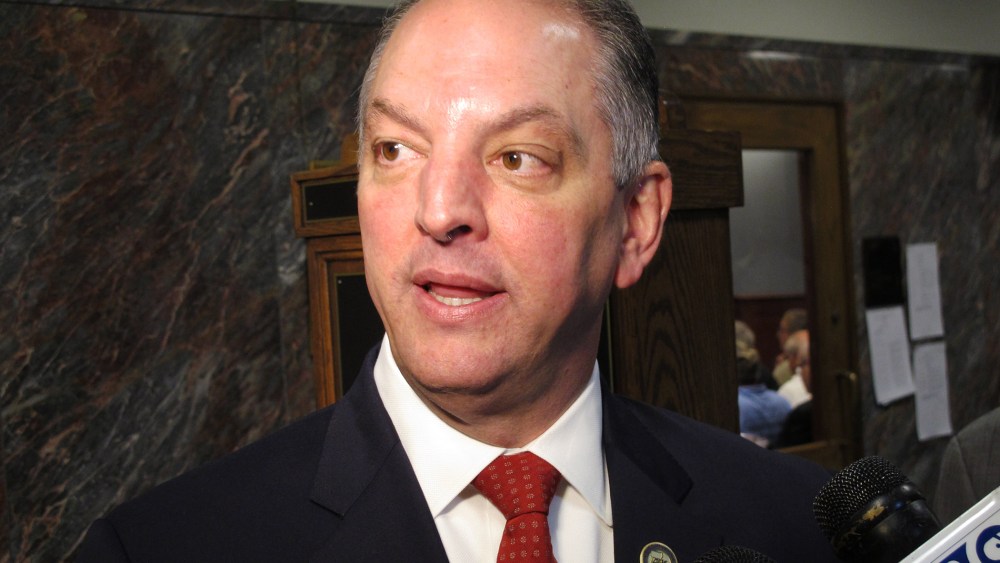 Louisiana Gov. John Bel Edwards talks with reporters about his budget cut proposal for the upcoming fiscal year after speaking to the House Appropriations Committee, April 12, 2016, in Baton Rouge, La. (Photo by Melinda Deslatte/AP)
