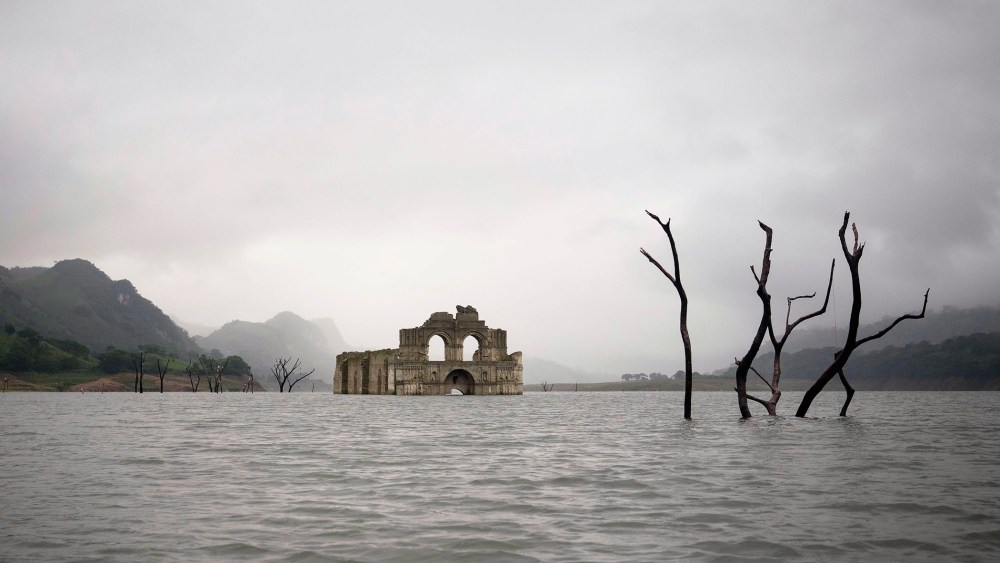 The remains of a mid-16th century church known as the Temple of Santiago, visible from the surface of the Grijalva River due to the lack of rain near the town of Nueva Quechula, in Chiapas state, Mexico, Oct. 16, 2015. (Photo by David von Blohn/AP)