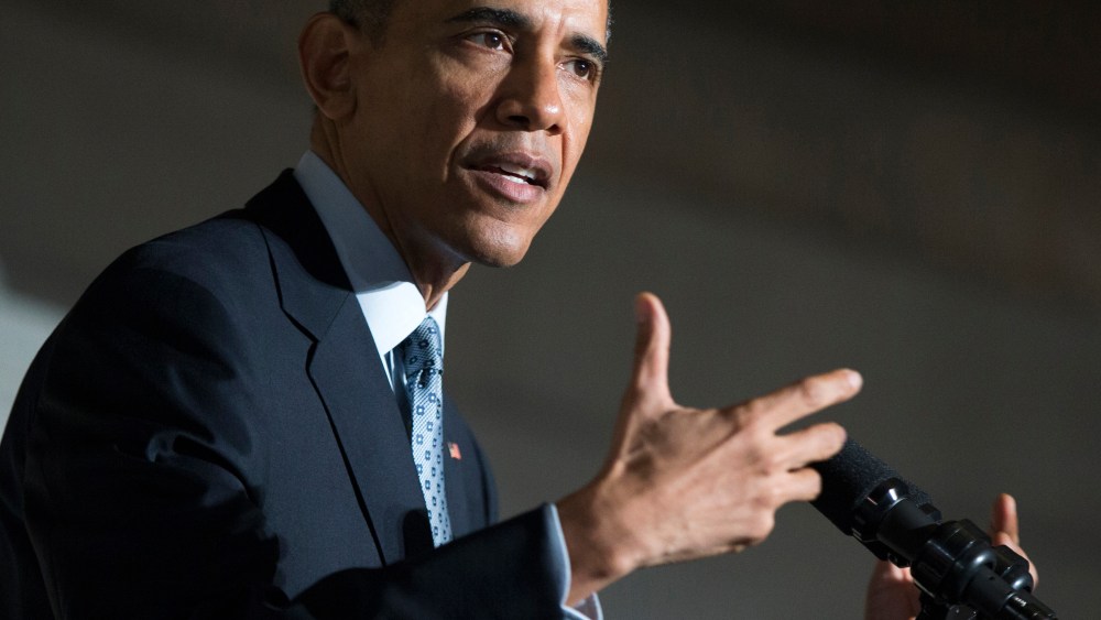 President Barack Obama speaks during a naturalization ceremony at the National Archives in Washington on Dec. 15, 2015. (Photo by Evan Vucci/AP)