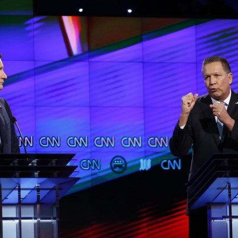 Republican presidential candidate, Ohio Gov. John Kasich, right, speaks as Republican presidential candidate, Sen. Ted Cruz, R-Texas, listens, during the Republican presidential debate on March 10, 2016, in Coral Gables, Fla. (Photo by Wilfredo Lee/AP)