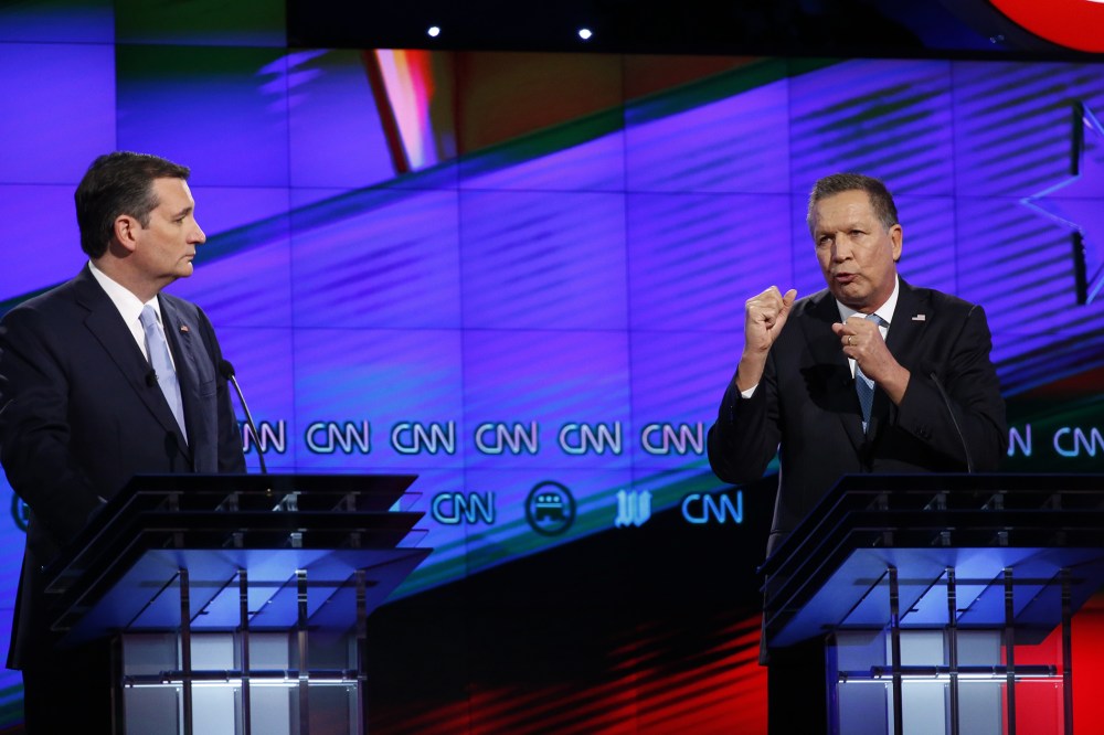 Republican presidential candidate, Ohio Gov. John Kasich, right, speaks as Republican presidential candidate, Sen. Ted Cruz, R-Texas, listens, during the Republican presidential debate on March 10, 2016, in Coral Gables, Fla. (Photo by Wilfredo Lee/AP)
