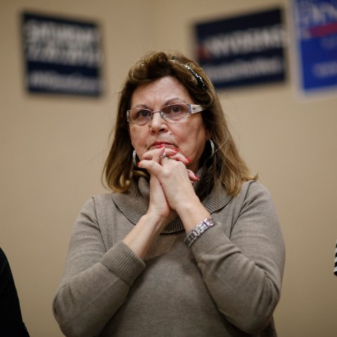 Teresa Parraga listens during a Latino get-out-the-caucus event, Feb. 16, 2016, in Las Vegas. (Photo by John Locher/AP)