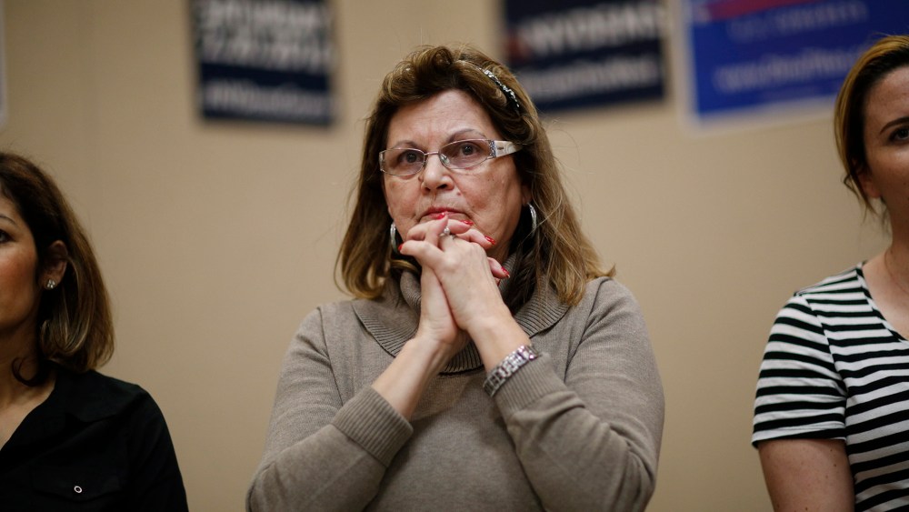 Teresa Parraga listens during a Latino get-out-the-caucus event, Feb. 16, 2016, in Las Vegas. (Photo by John Locher/AP)