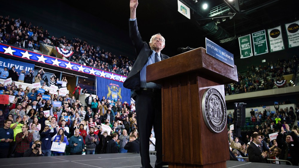 Democratic presidential candidate Sen. Bernie Sanders, I-Vt., waves during a rally at Eastern Michigan University, Feb. 15, 2016, in Ypsilanti, Mich. (Photo by Evan Vucci/AP)