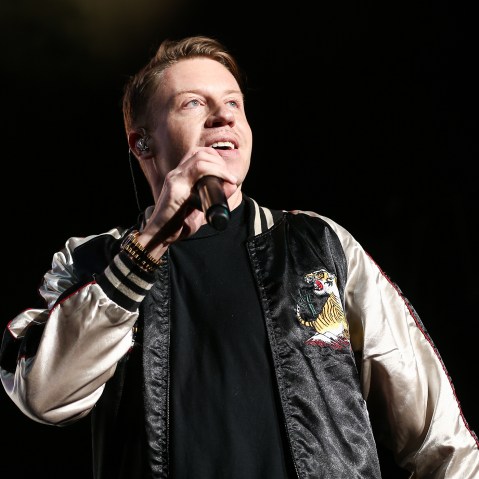 In this Dec. 4, 2015 file photo, Macklemore performs on stage at Power 106's Cali Christmas 2015 in Inglewood, Calif. (Photo by John Salangsang/Invision/AP)