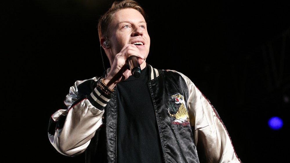In this Dec. 4, 2015 file photo, Macklemore performs on stage at Power 106's Cali Christmas 2015 in Inglewood, Calif. (Photo by John Salangsang/Invision/AP)