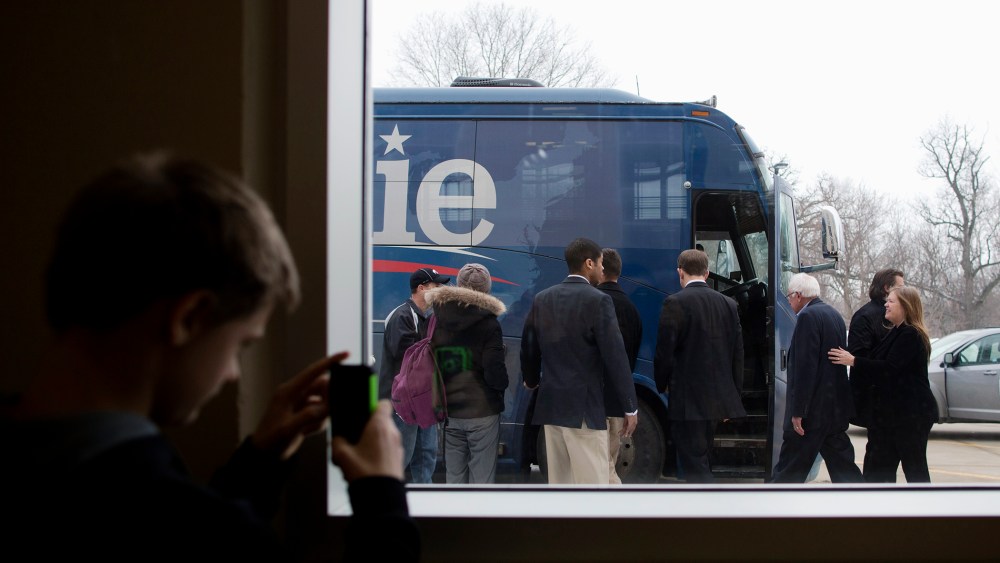 Harrison Pearce, 13, takes pictures of Democratic presidential candidate Sen. Bernie Sanders (I-Vt.) after a campaign event, Jan. 25, 2016, in Iowa Falls, Iowa. (Photo by Jae C. Hong/AP)