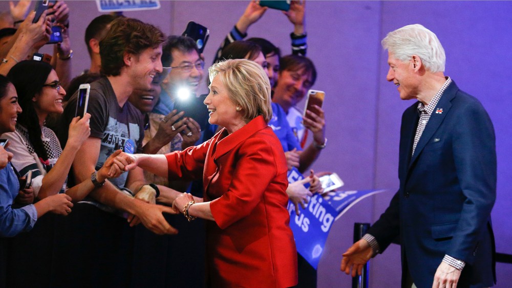 Democratic presidential candidate Hillary Clinton greets supporters with her husband and former President Bill Clinton at a Nevada Democratic caucus rally on Feb. 20, 2016, in Las Vegas, Nev. (Photo by John Locher/AP)