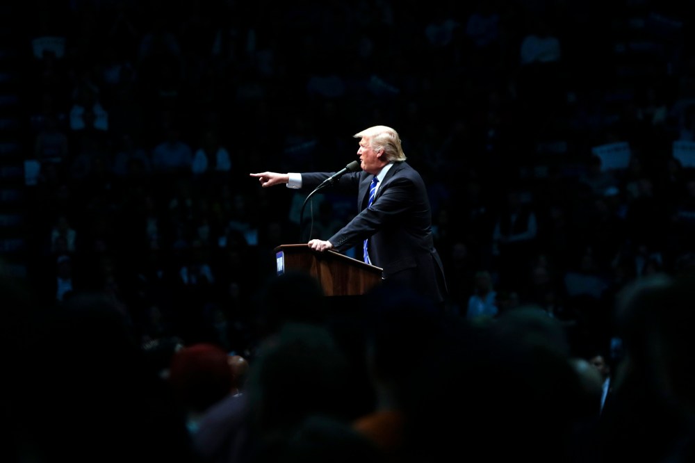 Republican presidential candidate Donald Trump gestures as he speaks during a rally at the Times Union Center on April 11, 2016, in Albany, N.Y.