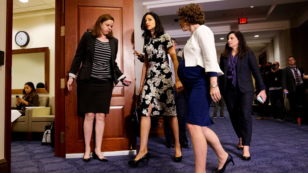 A longtime aide to Democratic presidential candidate Hillary Rodham Clinton returns to a hearing room on Capitol Hill in Washington, Oct. 16, 2015. (Photo by Jacquelyn Martin/AP)