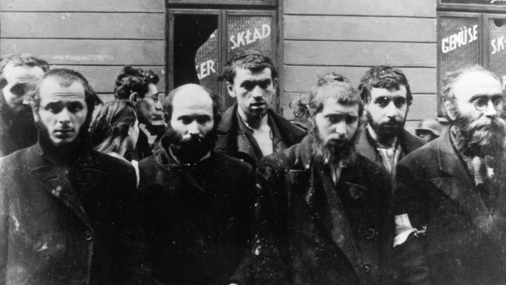 A group of religious Jews are held under arrest by German SS soldiers, April/May 1943, during the destruction of the Warsaw Ghetto by German troops, following an uprising in the Jewish quarter. (Photo by AP)