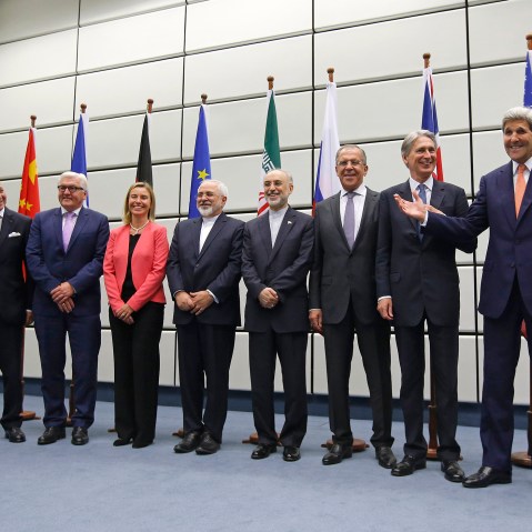 World powers pose for a group picture at the United Nations building in Vienna, Austria on July 14, 2015. (Photo by Carlos Barria/Pool/AP)