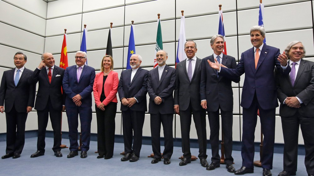 World powers pose for a group picture at the United Nations building in Vienna, Austria on July 14, 2015. (Photo by Carlos Barria/Pool/AP)