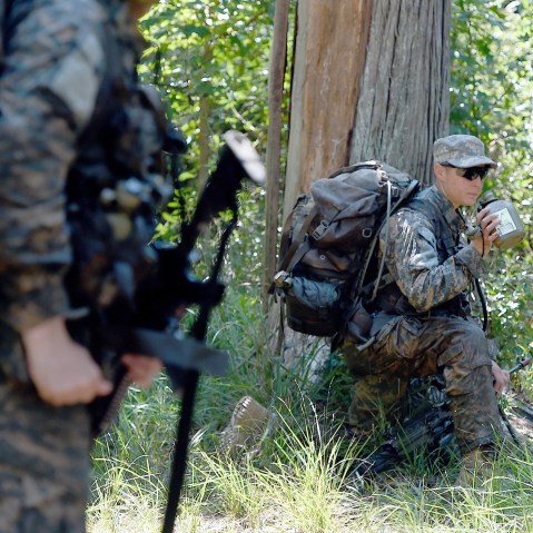 A female Ranger student holds a position with her team during an exercise on Aug. 4, 2015, at Camp James E. Rudder on Eglin Air Force Base, Fla. (Photo by Nick Tomecek/Northwest Florida Daily News/AP)