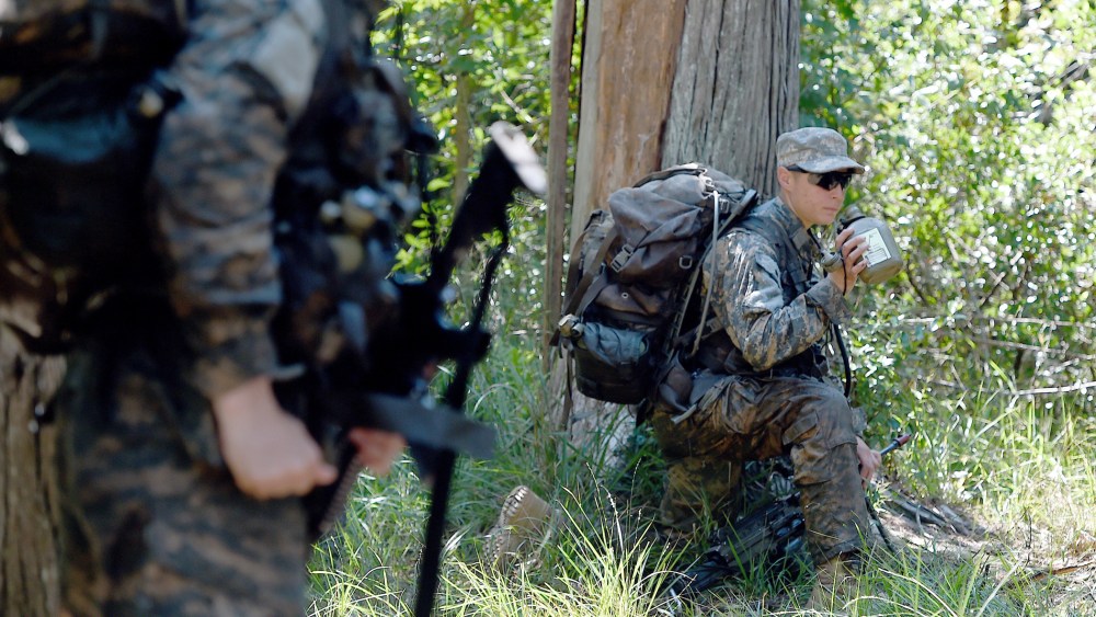 A female Ranger student holds a position with her team during an exercise on Aug. 4, 2015, at Camp James E. Rudder on Eglin Air Force Base, Fla. (Photo by Nick Tomecek/Northwest Florida Daily News/AP)