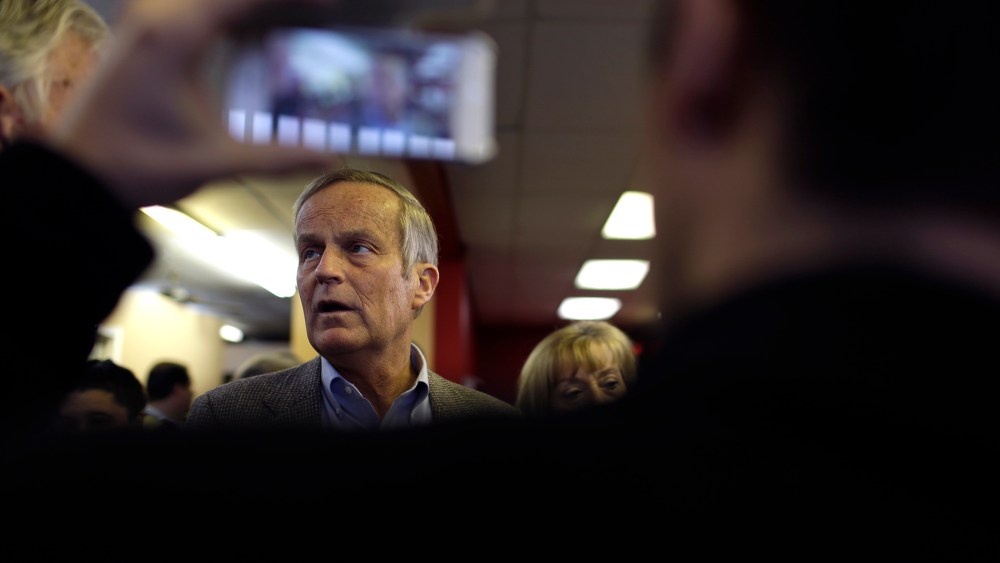 Then, Missouri Senate candidate, Rep. Todd Akin, R-Mo., visits with supporters during a stop to a Republican campaign office, Nov. 5, 2012, in Florissant, Mo. (Photo by Jeff Roberson/AP)