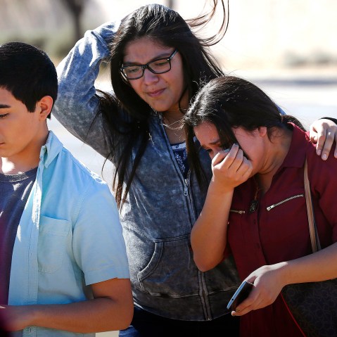 Students walk to their parents after being released from lockdown, Feb. 12, 2016, in Glendale, Ariz., after two students were shot and killed at Independence High School. (Photo by Matt York/AP)