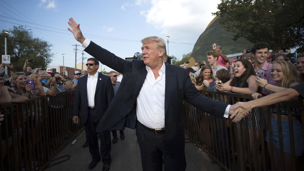 Republican presidential candidate Donald Trump greeets supporters before he delivers his message during a campaign rally at the state fair in Oklahoma City, Sept. 25, 2015. (Photo by J Pat Carter/AP)