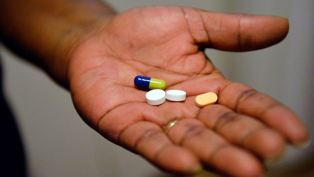 In this Friday, Jan. 8, 2016 photo, a woman shows just a few of the pills that she takes daily to alleviate her anxiety, while at her York home, Pa. (Photo by Chris Dunn/York Daily Record/AP)
