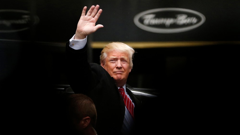 Republican presidential candidate Donald Trump acknowledges supporters while leaving Trump Tower on his way to visit the World Trade Center Museum, April 9, 2016, in New York. (Photo by Julio Cortez/AP)
