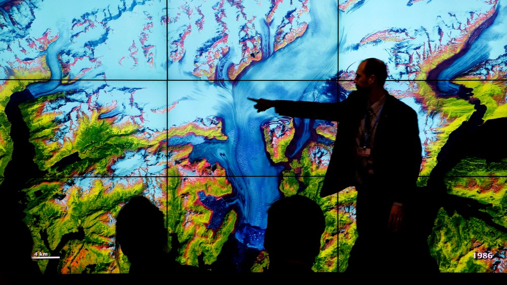 People attend a climate conference at the U.S. pavilion during the COP21, United Nations Climate Change Conference in Le Bourget, north of Paris, Dec. 10, 2015. (Photo by Christophe Ena/AP)