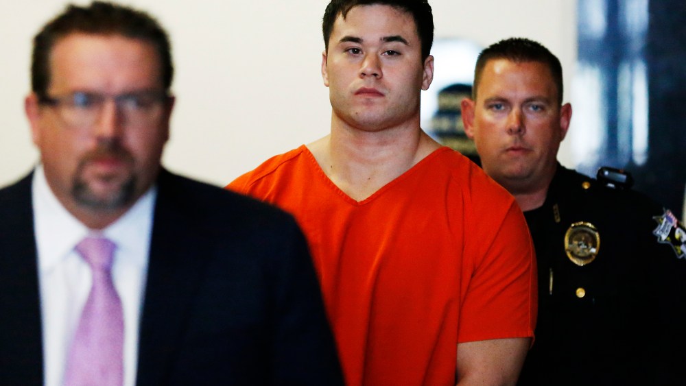 In this Sept. 3, 2014, file photo Daniel Holtzclaw, center, arrives for a hearing in Oklahoma City. (Photo by Sue Ogrocki/AP)