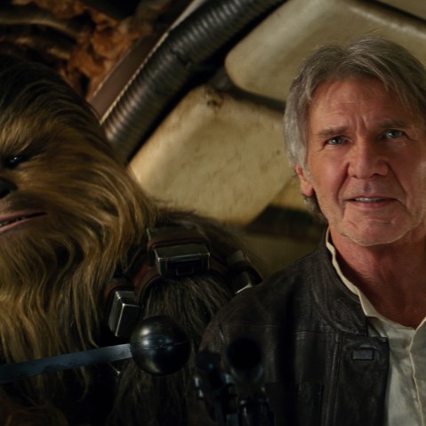 This image released by Lucasfilm shows character Chewbacca, left, and Harrison Ford in a scene from "Star Wars: The Force Awakens." (Photo by Lucasfilm/AP)