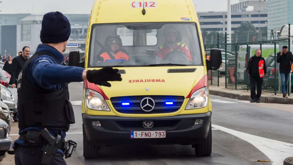Ambulances arrive to the scene at Brussels airport, after explosions rocked the facility in Brussels, Belgium, March 22, 2016. (Photo by Geert Vanden Wijngaert/AP)
