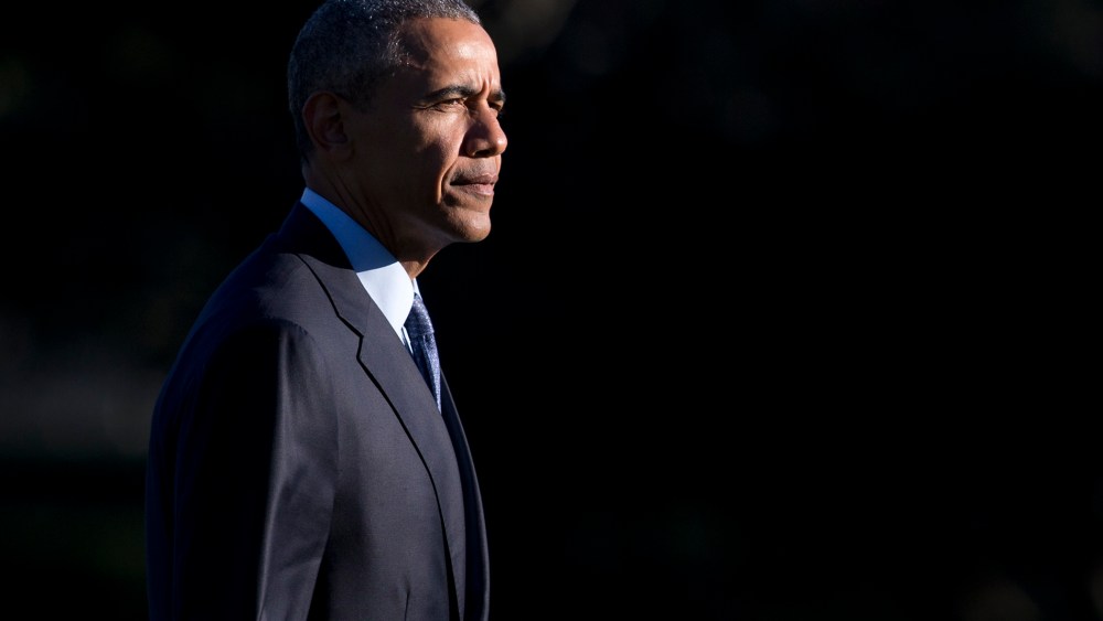 President Barack Obama walks across the South Lawn of the White House from Marine One, March 29, 2016, in Washington, D.C. (Photo by Carolyn Kaster/AP)