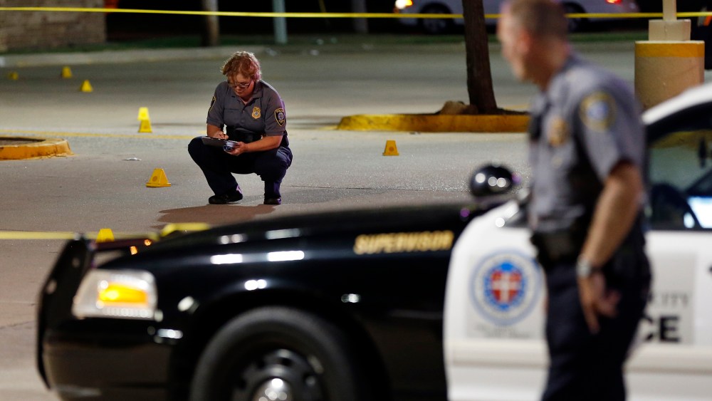Police investigate the scene where Oklahoma Labor Commissioner Mark Costello was fatally stabbed, Aug. 23, 2015, in Oklahoma City. (Photo by Nate Billings/The Oklahoman/AP)