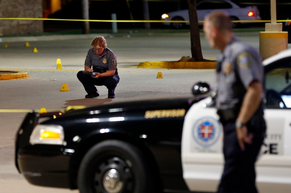 Police investigate the scene where Oklahoma Labor Commissioner Mark Costello was fatally stabbed, Aug. 23, 2015, in Oklahoma City. (Photo by Nate Billings/The Oklahoman/AP)
