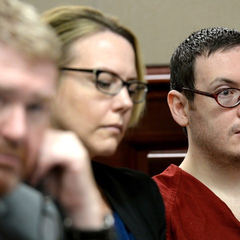 Defense attorneys Daniel King, left, and Katherine Spengler, sits at a table with James Holmes, right, as he appears in court for the sentencing phase of his trial Tuesday, Aug. 25, 2015. (Photo by RJ Sangosti/AP)