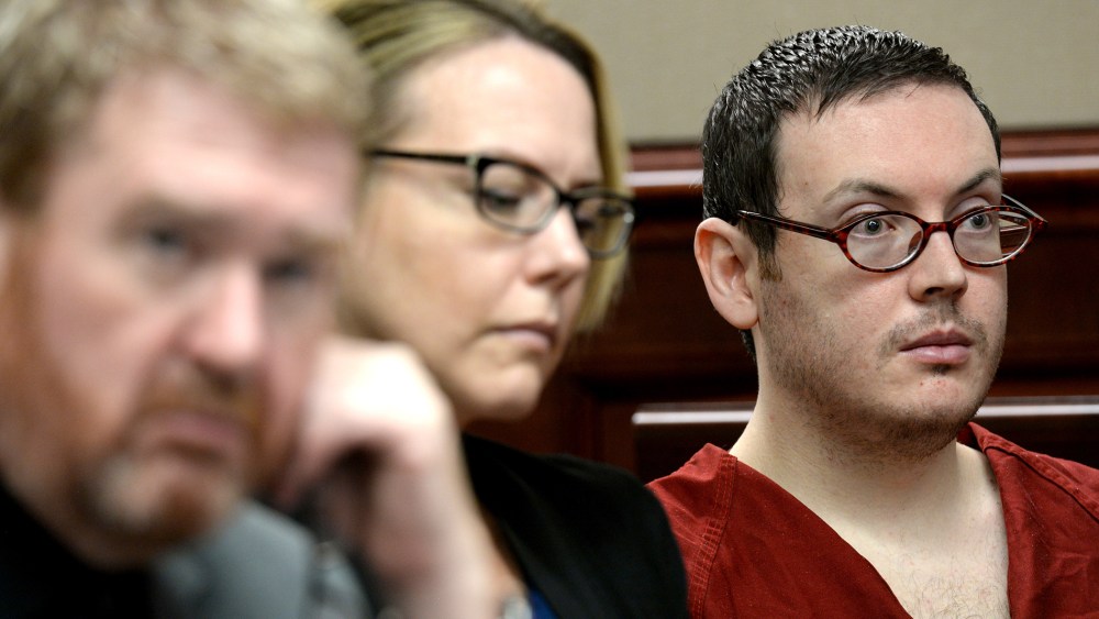 Defense attorneys Daniel King, left, and Katherine Spengler, sits at a table with James Holmes, right, as he appears in court for the sentencing phase of his trial Tuesday, Aug. 25, 2015. (Photo by RJ Sangosti/AP)