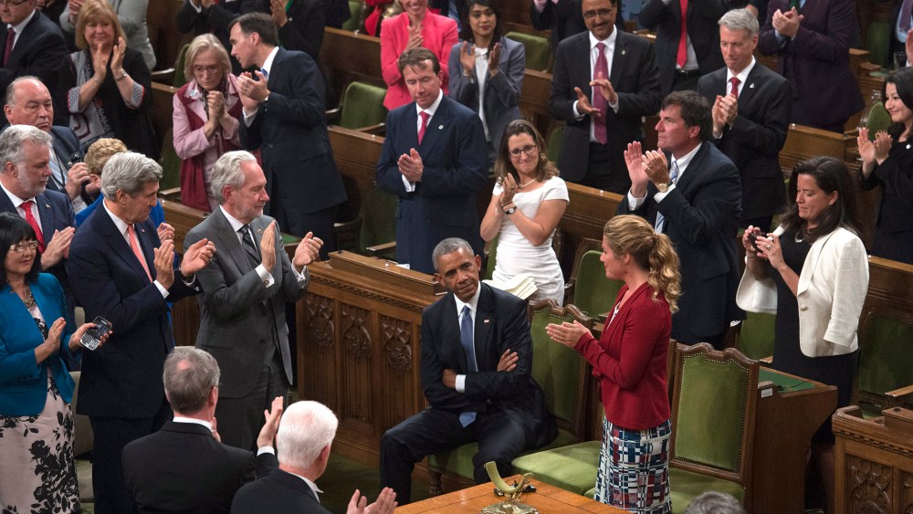 President Barack Obama receives a standing ovation in the House of Commons on Parliament Hill in Ottawa, Canada, June 29, 2016. (Photo by Adrian Wyld/The Canadian Press/AP)