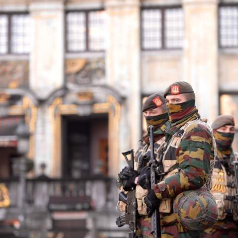 Soldiers and police patrol the city center in Brussels on Nov. 23, 2015. (Photo by Jakub Dospiva/CTK/AP)