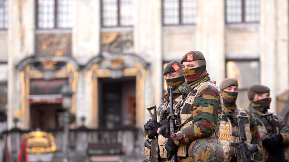 Soldiers and police patrol the city center in Brussels on Nov. 23, 2015. (Photo by Jakub Dospiva/CTK/AP)