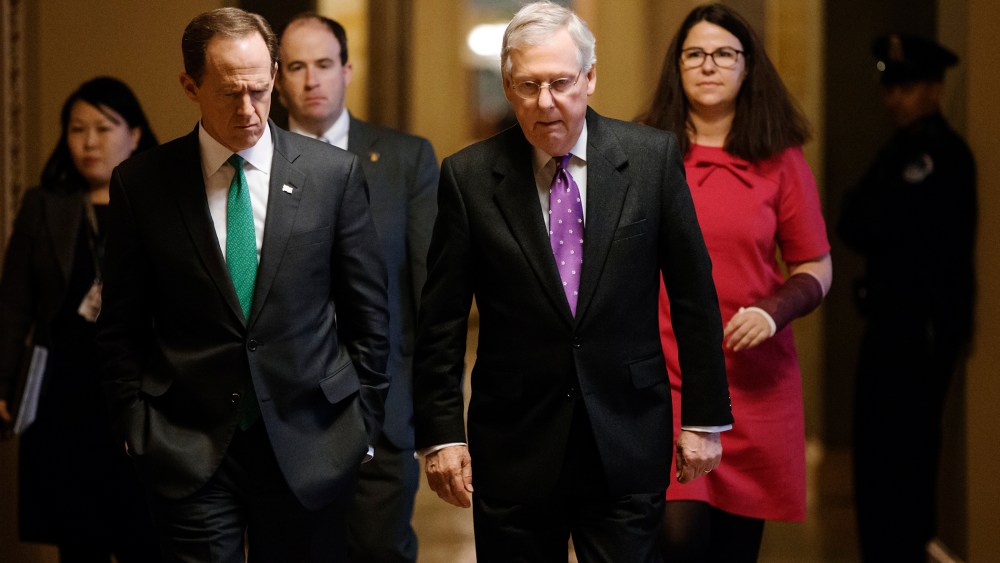 Senate Majority Leader Mitch McConnell, R-Ky., walks with Sen. Pat Toomey, R-Pa. to the chamber to vote at the Capitol in Washington, Feb. 10, 2016. (Photo by J. Scott Applewhite/AP)