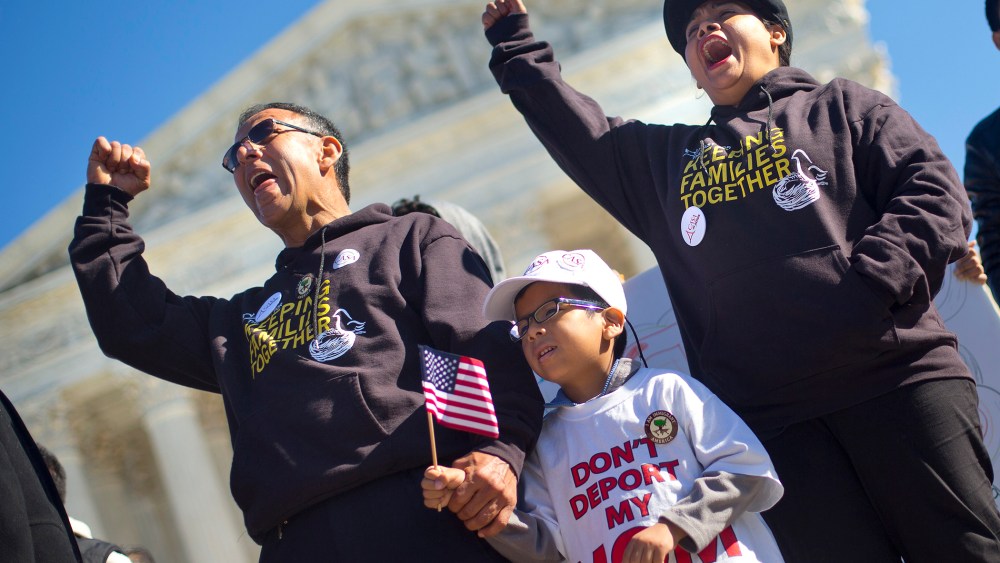 Six-year-old Michael Claros, center, joins his parents during a rally for immigration reform, Nov. 20, 2015, at the Supreme Court in Washington. (Photo by Pablo Martinez Monsivais/AP)