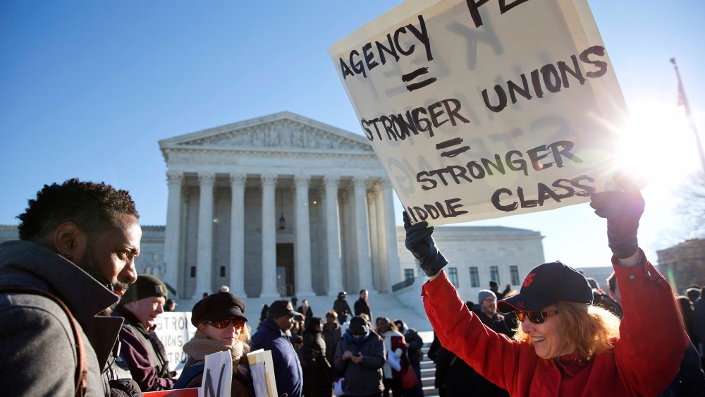 Protesters rally outside of the Supreme Court in Washington, Jan. 11, 2016, as the court heard arguments in the 'Friedrichs v. California Teachers Association' case. (Photo by Jacquelyn Martin/AP)