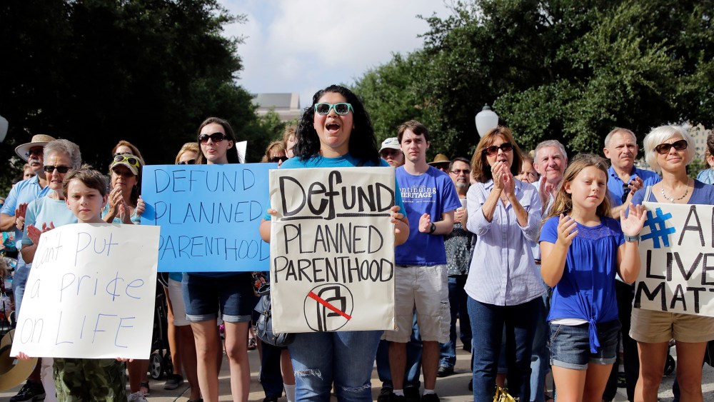 Anti-abortion activists rally on the steps of the Texas Capitol to condemn the use in medical research of tissue samples from aborted fetuses, on July 28, 2015, in Austin, Texas. (hoto by Eric Gay/AP).