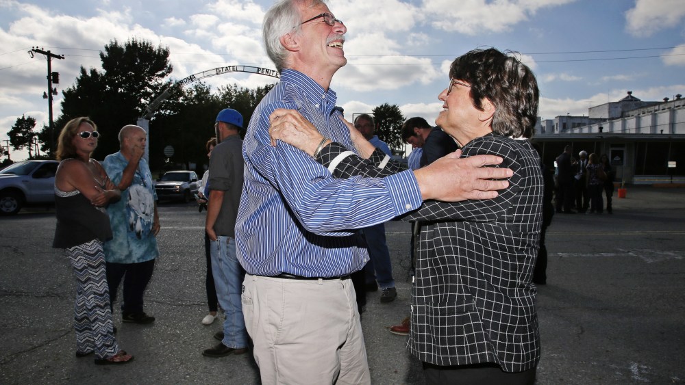Death penalty opponent Sister Helen Prejean celebrates with a friend of death row inmate Richard Glossip after his scheduled execution was postponed outside the Oklahoma State Penitentiary in McAlester, Okla., Sept. 30, 2015. (Photo by Sue Ogrocki/AP)
