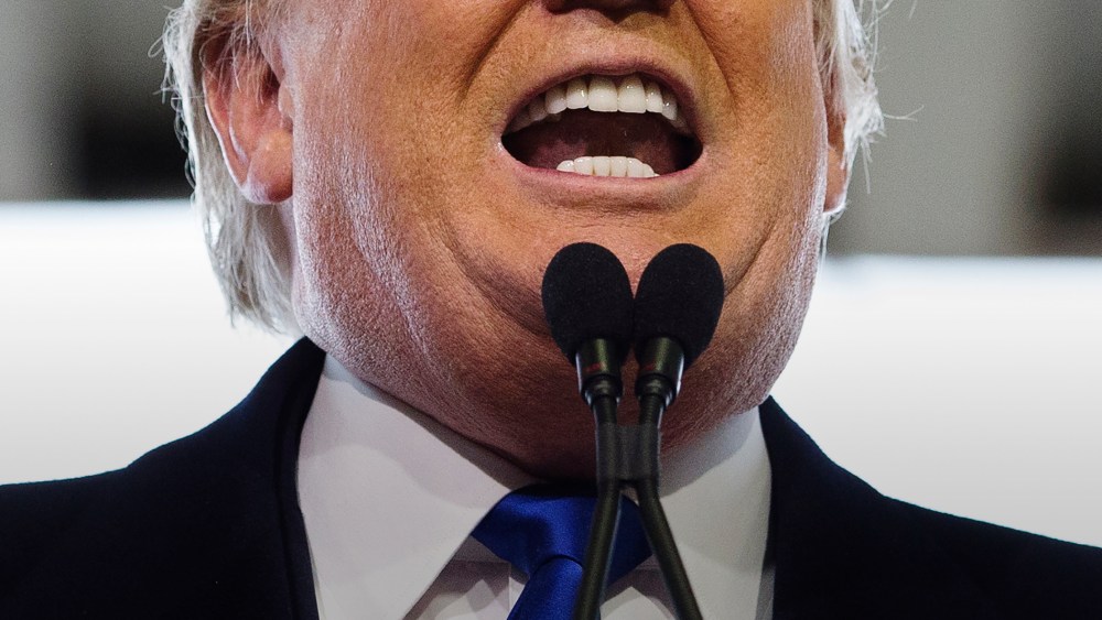 Republican presidential candidate Donald Trump bares his teeth during a campaign stop at the Signature Flight Hangar at Port-Columbus International Airport, March 1, 2016, in Columbus, Ohio. (Photo by John Minchillo/AP)