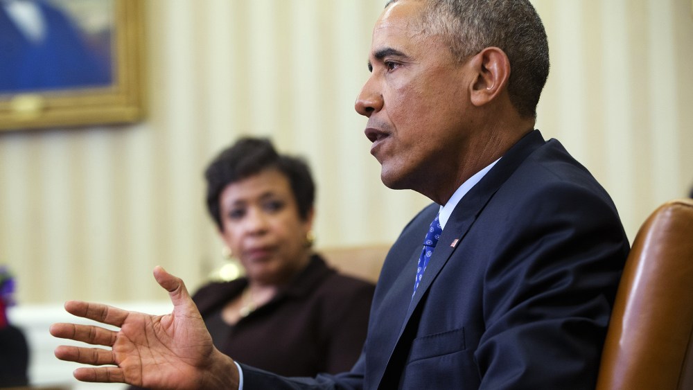 Attorney General Loretta Lynch listens as President Barack Obama speaks in the Oval Office of the White House in Washington, Jan. 4, 2016. (Photo by Pablo Martinez Monsivais/AP)