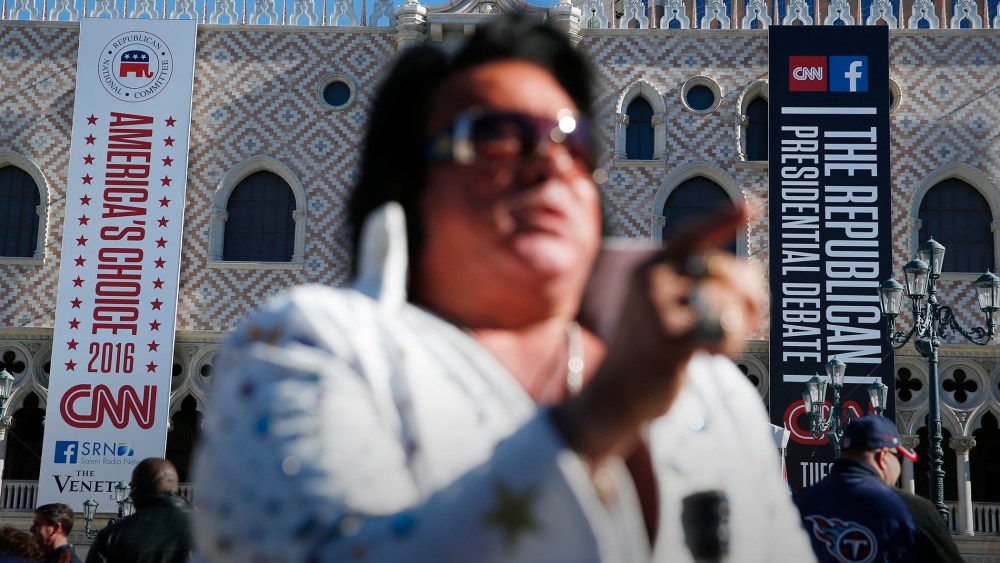 An Elvis impersonator performs outside the Venetian Hotel & Casino before the CNN Republican presidential debate on Dec. 15, 2015, in Las Vegas. (Photo by John Locher/AP)
