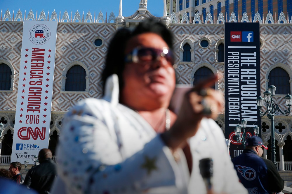 An Elvis impersonator performs outside the Venetian Hotel & Casino before the CNN Republican presidential debate on Dec. 15, 2015, in Las Vegas. (Photo by John Locher/AP)