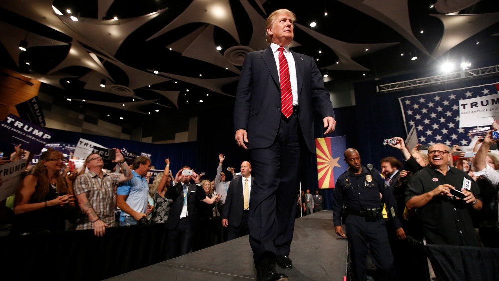 Republican presidential candidate Donald Trump walks on stage to speak before a crowd of 3,500 on July 11, 2015, in Phoenix, Ariz. (Photo by Ross D. Franklin/AP)