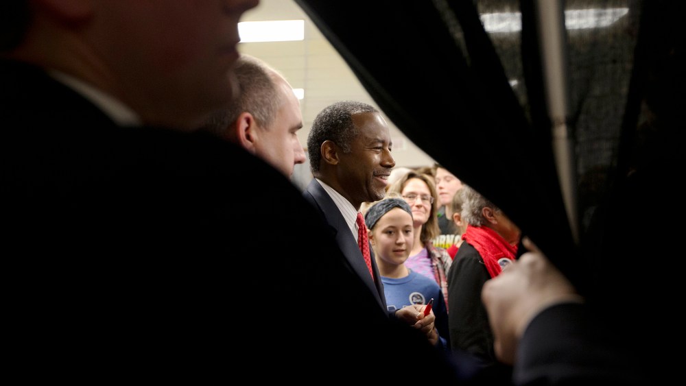 Republican presidential candidate Dr. Ben Carson, center, shakes hands with supporters at a town hall, Jan. 6, 2016, in Panora, Iowa. (Photo by Jae C. Hong/AP)