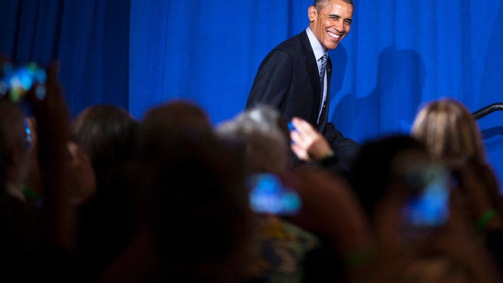 President Barack Obama smiles as he arrives to speak during a Organizing for Action event, on Nov. 9, 2015, in Washington, D.C. (Photo by Evan Vucci/AP)